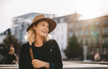 beautiful mature woman in hat laughs